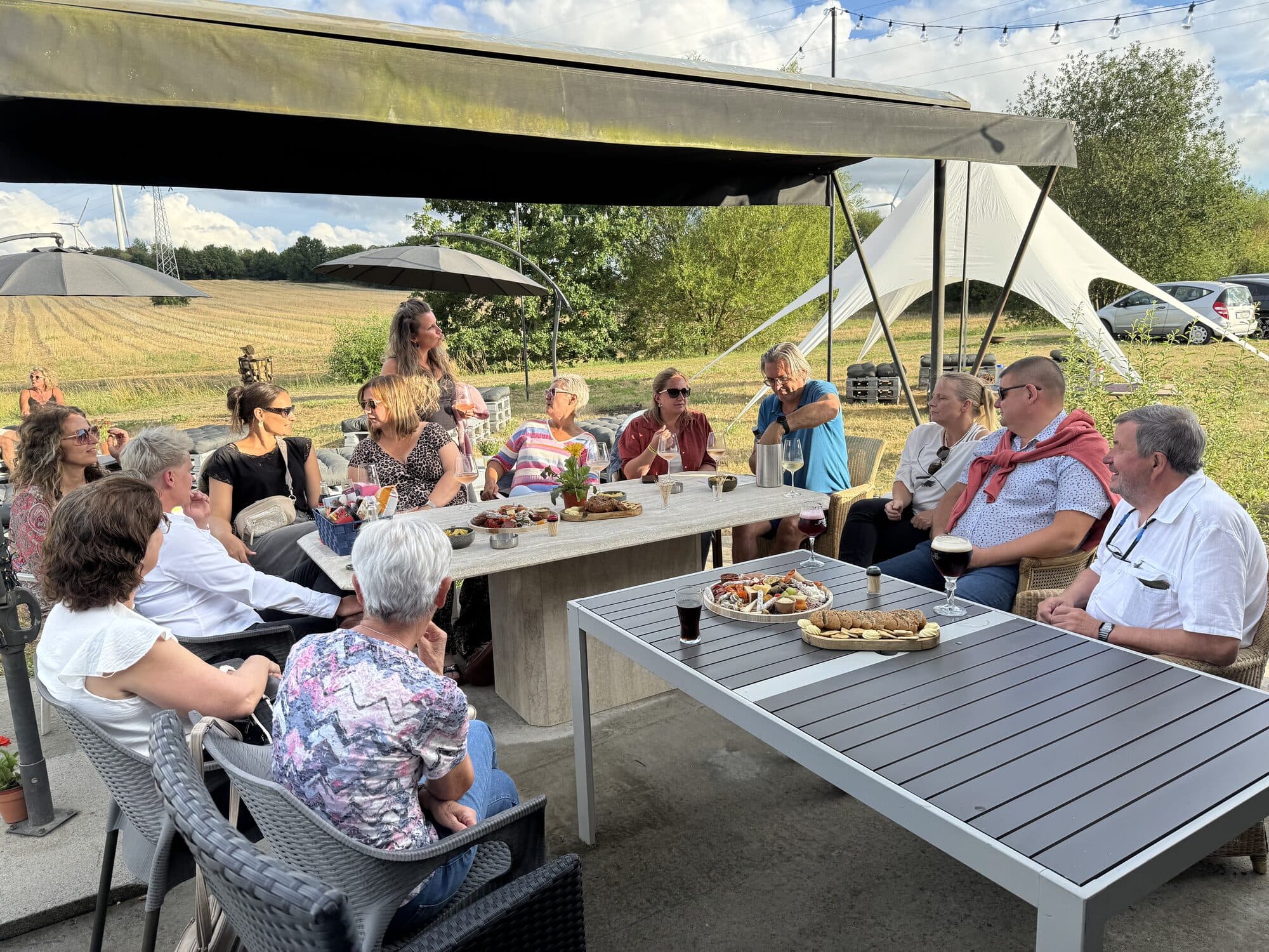 GreyHouse Summer Bar — guests gathered at sunset